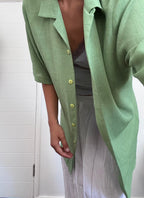 Green button up shirt