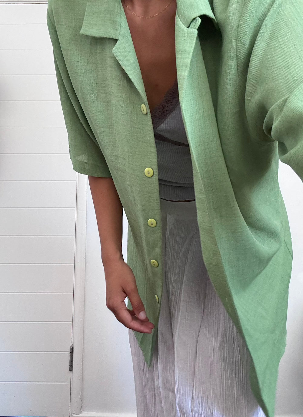 Green button up shirt