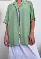 Green button up shirt