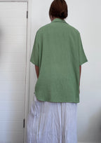 Green button up shirt