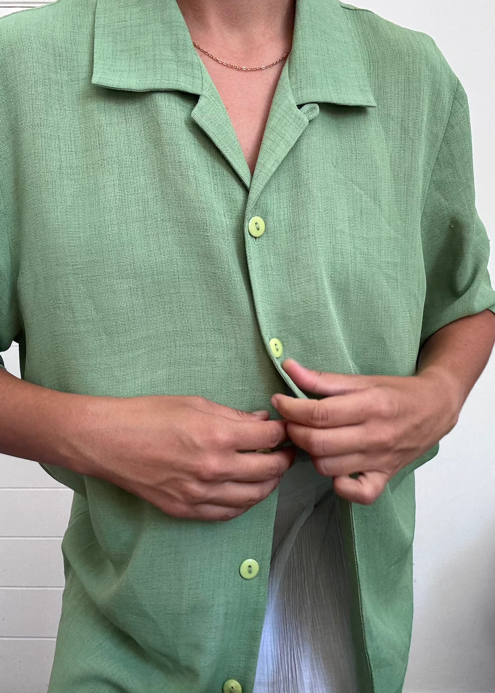 Green button up shirt