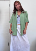 Green button up shirt