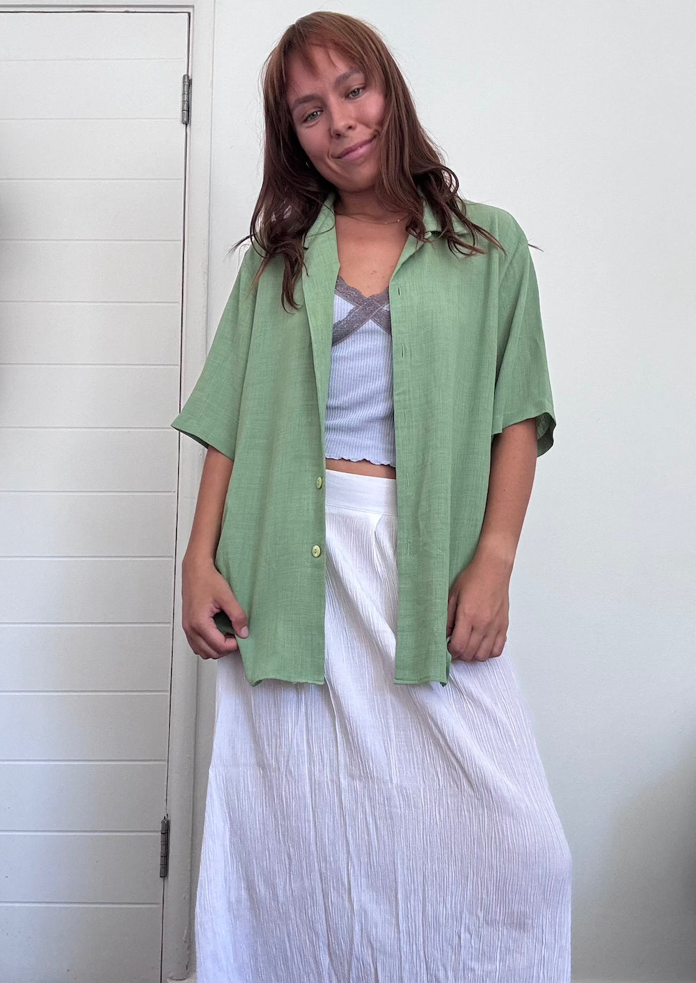 Green button up shirt