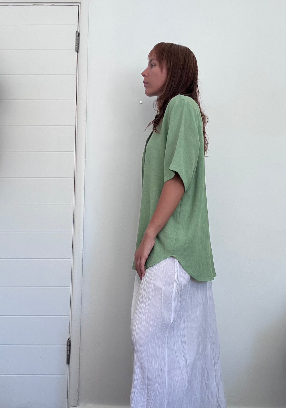 Green button up shirt